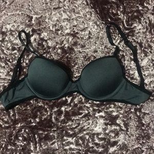 Dark grey padded push up bra with black trim.